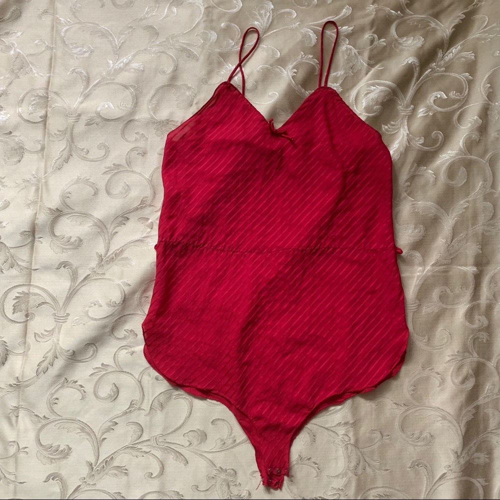Pink lingerie one piece with clasp closure.